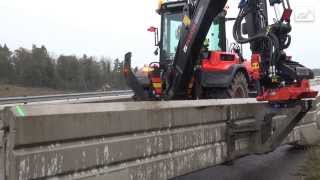 Handling heavy barrier blocks on a freeway with a HUDDIG 1260C [upl. by Litman575]