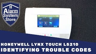 How To Clear Trouble Conditions On Honeywell Lynx L5210  AlarmSystemStore [upl. by Aivatnohs]