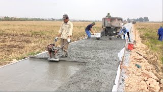 Construction A Concrete Road Stretching On Rural Fields With ReadyMixed Concrete [upl. by Leumek297]