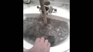 Unclogging a bathroom sink [upl. by Hayotal]